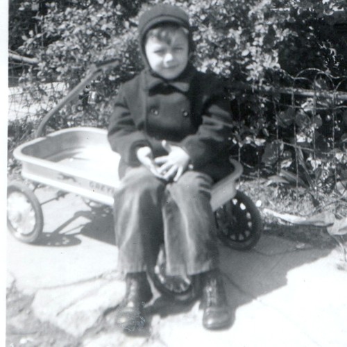 1949 boy sitting metal coaster - sitting,